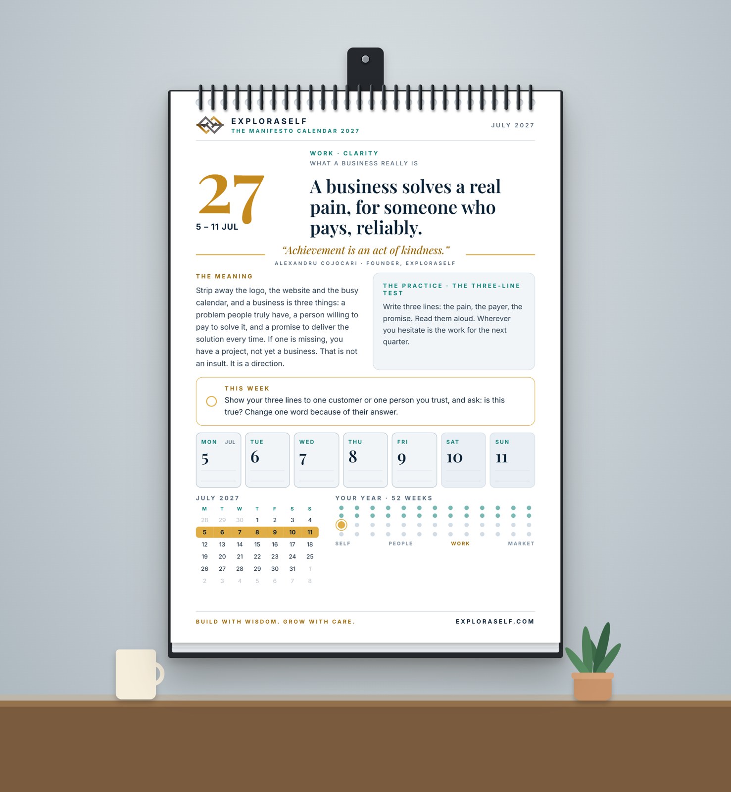 The White edition printed and hanging on a wall, spiral-bound